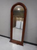 An early 20th century mahogany arched topped hall mirror