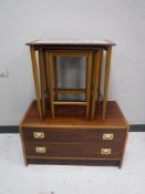A nest of three mid twentieth century teak tile topped tables,