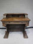 A Victorian carved mahogany writing desk