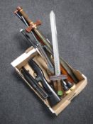 A box of play swords, toy rifles,