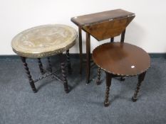 An Eastern brass top table on stand,