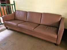 A late twentieth century Danish brown leather three seater settee