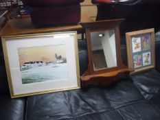 An Edwardian mahogany wall mirror with shelf,
