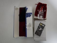 A boxed Swarovski Collector's Society figure of a swan,