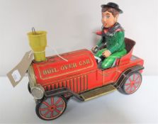 A mid 20th century tin plate boil over car