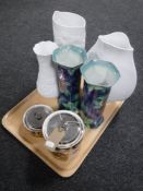 A tray of three Kaiser floral vases,