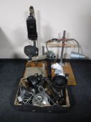 Three photographic enlargers and a box of enlarger lamps