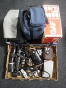 Two camera bags and a box of assorted cameras, lenses including Praktika and Minolta,