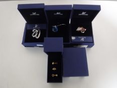 Three boxed Swarovski brooches and a box of three Swarovski rings