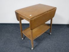 An Ercol drop leaf tea trolley