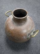 An antique copper pot