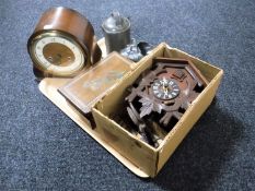 A tray containing Black Forest style cuckoo clock, wooden trinket box, Smiths mantel clock,