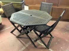 A octagonal teak folding garden table,