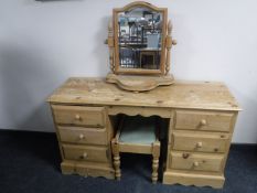 A pine knee hole dressing table with stool and mirror