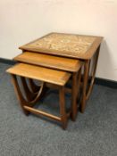 A contemporary nest of G Plan teak tables