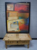 An Ikea coffee table fitted a drawer and an Ikea canvas