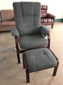 A wood framed upholstered high back armchair,
