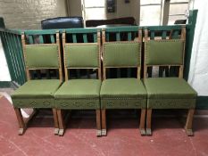 A set of four early twentieth century oak dining chairs,