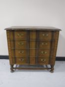 A continental oak shaped front four drawer chest