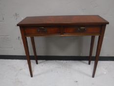 An inlaid mahogany hall table fitted two drawers