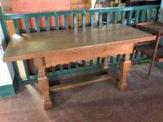 An early twentieth century oak dining table,