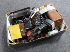 A box of assorted cameras and accessories,