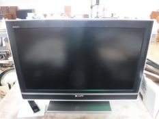 A Sony Bravia 32 inch LCD TV with remote