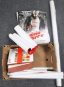 A box of assorted movie posters,