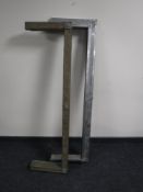 An early 20th century brass fire curb and a chrome fire curb