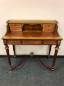 A reproduction inlaid walnut lady's desk with gilt brass mounts,