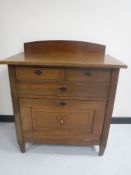 An early twentieth century continental oak serving cabinet
