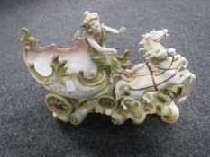 A continental china figure depicting a female on a chariot