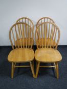 A set of four pine kitchen chairs