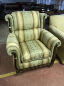 A wood framed armchair in a Regency style fabric