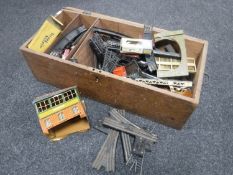 A pine box containing mid twentieth century Trix twin railway rolling stock,