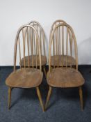 A set of four Ercol elm high back dining chairs