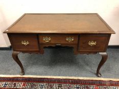 A Georgian style three drawer mahogany desk,