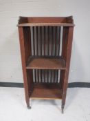 A stained pine three tier book stand