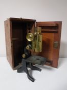 An early 20th century brass and lacquered metal army microscope by J Swift & Sons,