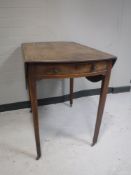 A George III mahogany Pembroke table fitted a drawer