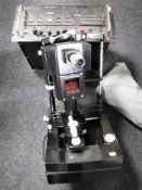 A vintage scaling unit type 1221C together with an American opticians machine