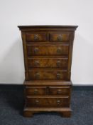 A walnut Georgian style eight drawer chest
