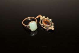 A gold dress ring and a citrine pendant