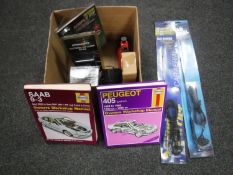 A box of Haynes car manuals, car alarms, air gun,