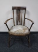 A Victorian inlaid mahogany framed armchair