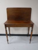A late nineteenth century mahogany turnover top tea table