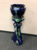 An Art Nouveau style jardiniere on stand