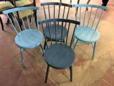 A set of four painted kitchen chairs