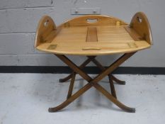 A mahogany butlers tray on stand