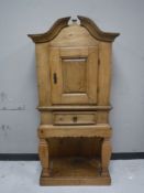 A late nineteenth century continental oak cabinet on stand